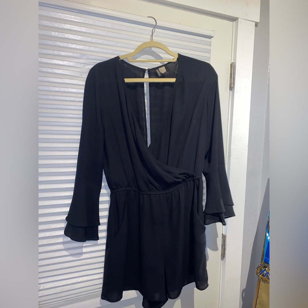 Low cut open back long sleeve black romper